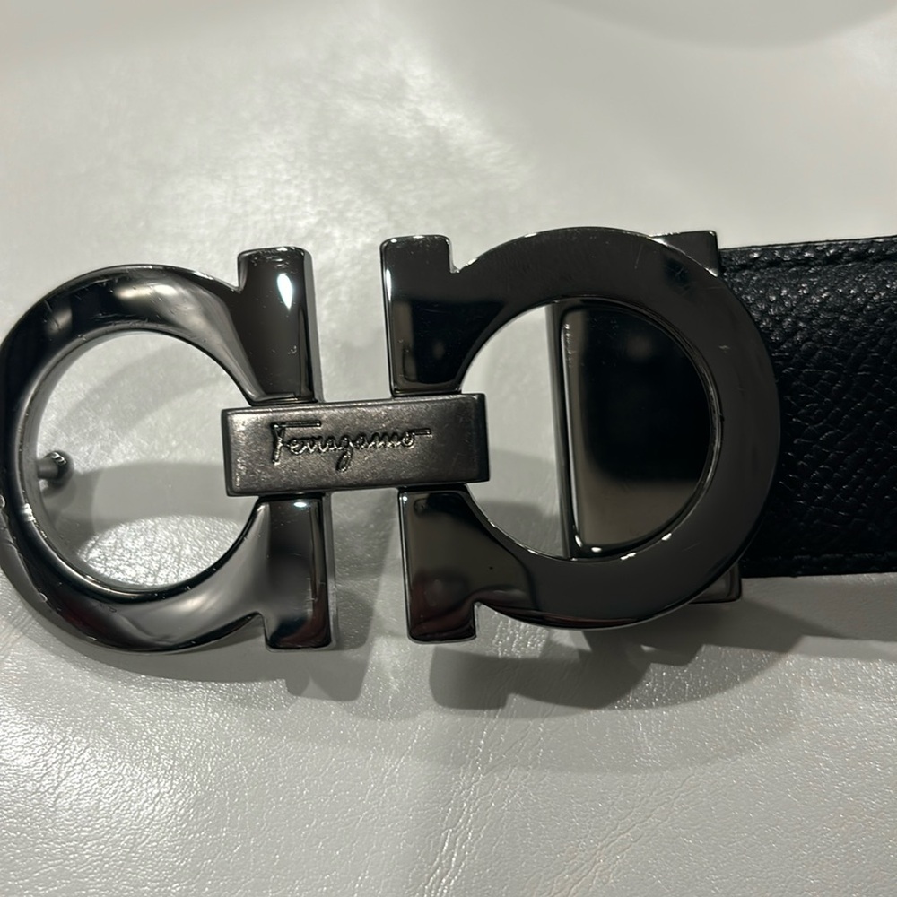 Women's Ferragamo silver buckle reversible belt.  Black and Brown